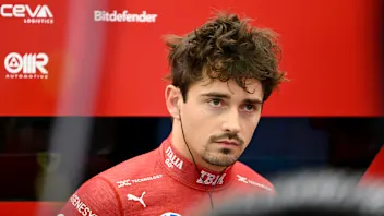 BAHRAIN, BAHRAIN - APRIL 11: Charles Leclerc of Monaco and Scuderia Ferrari looks on in the garage