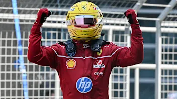 TOPSHOT - Ferrari's British driver Lewis Hamilton celebrates winning the sprint race of the Formula