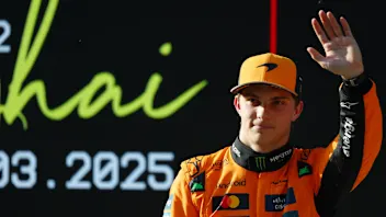 TOPSHOT - McLaren's Australian driver Oscar Piastri gives a thumbs as he celebrates taking pole