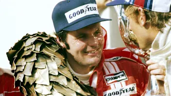 (L to R): Alan Jones (AUS) Shadow celebrates on the podium with Hans-Joachim Stuck (GER) Brabham