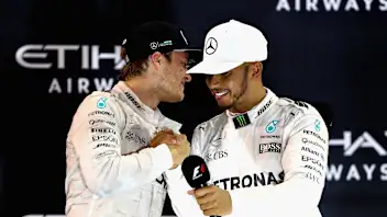 ABU DHABI, UNITED ARAB EMIRATES - NOVEMBER 27: Race winner Lewis Hamilton of Great Britain and