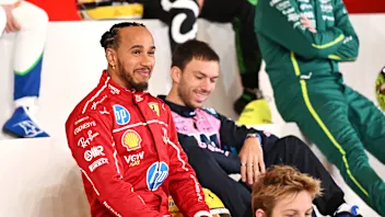 BAHRAIN, BAHRAIN - FEBRUARY 26: Lewis Hamilton of Great Britain and Scuderia Ferrari looks on