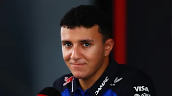 KUALA LUMPUR, MALAYSIA - OCTOBER 01: Isack Hadjar of France and Oracle Red Bull Racing talks to the