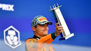 MIAMI, FLORIDA - MAY 03: Second placed Lando Norris of Great Britain and McLaren lifts his trophy