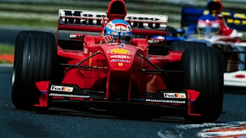 HUNGARORING, HUNGARY - AUGUST 15: Mika Salo, Ferrari F399, leads Jacques Villeneuve, BAR 01