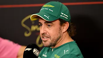 SINGAPORE, SINGAPORE - OCTOBER 08: Fernando Alonso of Spain and Aston Martin F1 Team speaks in the