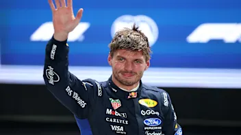 SINGAPORE, SINGAPORE - OCTOBER 10: Pole position qualifier Max Verstappen of the Netherlands and