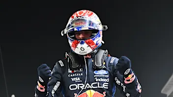 SINGAPORE, SINGAPORE - OCTOBER 10: Pole position qualifier Max Verstappen of the Netherlands and