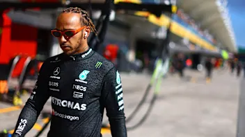 SAO PAULO, BRAZIL - NOVEMBER 04: Lewis Hamilton of Great Britain and Mercedes walks to the grid