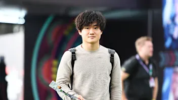 MEXICO CITY, MEXICO - OCTOBER 27: Yuki Tsunoda of Japan and Scuderia AlphaTauri walks in the