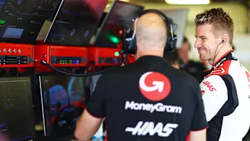 MEXICO CITY, MEXICO - OCTOBER 28: Nico Hulkenberg of Germany and Haas F1 talks with a Haas F1 team