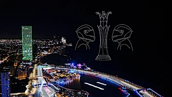 JEDDAH, SAUDI ARABIA - MARCH 19: A drone light display showing racing drivers is seen over the grid