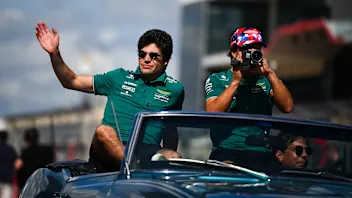 AUSTIN, TEXAS - OCTOBER 22: Lance Stroll of Canada and Aston Martin F1 Team and Fernando Alonso of