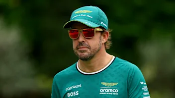 SINGAPORE, SINGAPORE - SEPTEMBER 20: Fernando Alonso of Spain and Aston Martin F1 Team walks in the