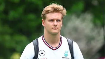 SINGAPORE, SINGAPORE - SEPTEMBER 19: Mick Schumacher of Germany, Reserve Driver of Mercedes walks