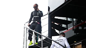 SPIELBERG, AUSTRIA - JUNE 28: Lewis Hamilton of Great Britain and Mercedes walks in the Paddock
