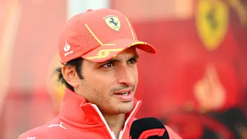 SUZUKA, JAPAN - APRIL 04: Carlos Sainz of Spain and Ferrari talks to the media in the Paddock