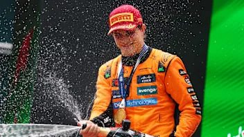 SHANGHAI, CHINA - MARCH 23: Race winner Oscar Piastri of Australia and McLaren lifts his trophy on