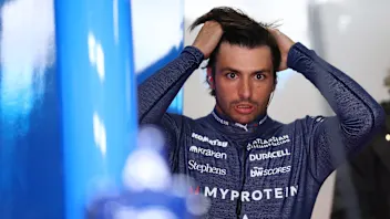 SUZUKA, JAPAN - APRIL 04: Carlos Sainz of Spain and Williams looks on in the garage during practice