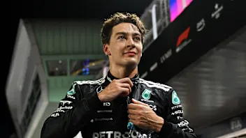 SINGAPORE, SINGAPORE - OCTOBER 04: Pole position qualifier George Russell of Great Britain and