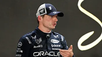 SINGAPORE, SINGAPORE - OCTOBER 04: Second placed qualifier Max Verstappen of the Netherlands and