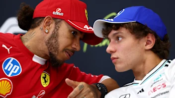 SPA, BELGIUM - JULY 24: Lewis Hamilton of Great Britain and Scuderia Ferrari talks with Andrea Kimi