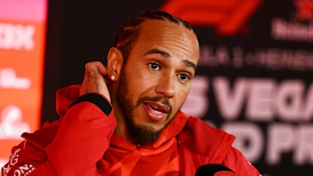 LAS VEGAS, NEVADA - NOVEMBER 19: Lewis Hamilton of Great Britain and Scuderia Ferrari talks to the