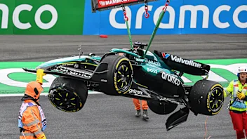 ZANDVOORT, NETHERLANDS - AUGUST 29: Marshals recover the damaged car of Lance Stroll of Canada and