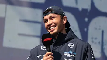 SHANGHAI, CHINA - MARCH 14: Alexander Albon of Thailand and Williams talks to the crowd on the fan