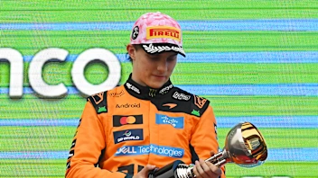 SUZUKA, JAPAN - MARCH 29: Second placed Oscar Piastri of Australia and McLaren inspects his trophy