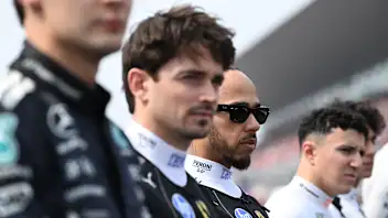 SUZUKA, JAPAN - MARCH 29: Lewis Hamilton of Great Britain and Scuderia Ferrari on the grid during