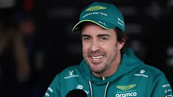 SUZUKA, JAPAN - MARCH 28: Twenty-first placed qualifier Fernando Alonso of Spain and Aston Martin