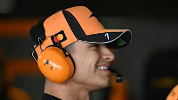 SUZUKA, JAPAN - MARCH 28: Lando Norris of Great Britain and McLaren looks on in the garage during