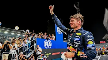 SINGAPORE, SINGAPORE - OCTOBER 10: Pole position qualifier Max Verstappen of the Netherlands and
