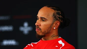 KUALA LUMPUR, MALAYSIA - OCTOBER 01: Lewis Hamilton of Great Britain and Scuderia Ferrari talks to