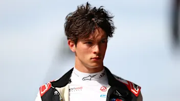 NORTHAMPTON, ENGLAND - JULY 03: Oliver Bearman of Great Britain and Haas F1 looks on in the Pitlane