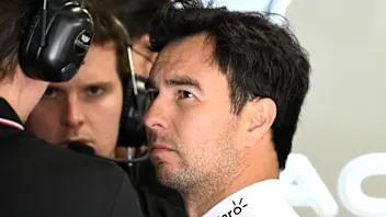 BUDAPEST, HUNGARY - JULY 25: Sergio Perez of Mexico and Cadillac F1 Team talks in the garage during