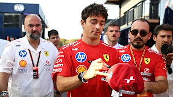 MONZA, ITALY - SEPTEMBER 06: Charles Leclerc of Monaco and Scuderia Ferrari signs an autograph