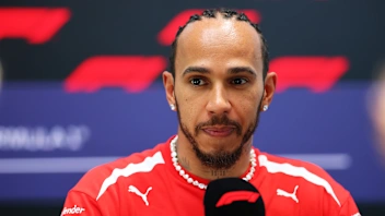 MIAMI, FLORIDA - APRIL 30: Lewis Hamilton of Great Britain and Scuderia Ferrari talks to the media
