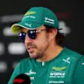 KUALA LUMPUR, MALAYSIA - OCTOBER 01: Fernando Alonso of Spain and Aston Martin F1 Team talks to the