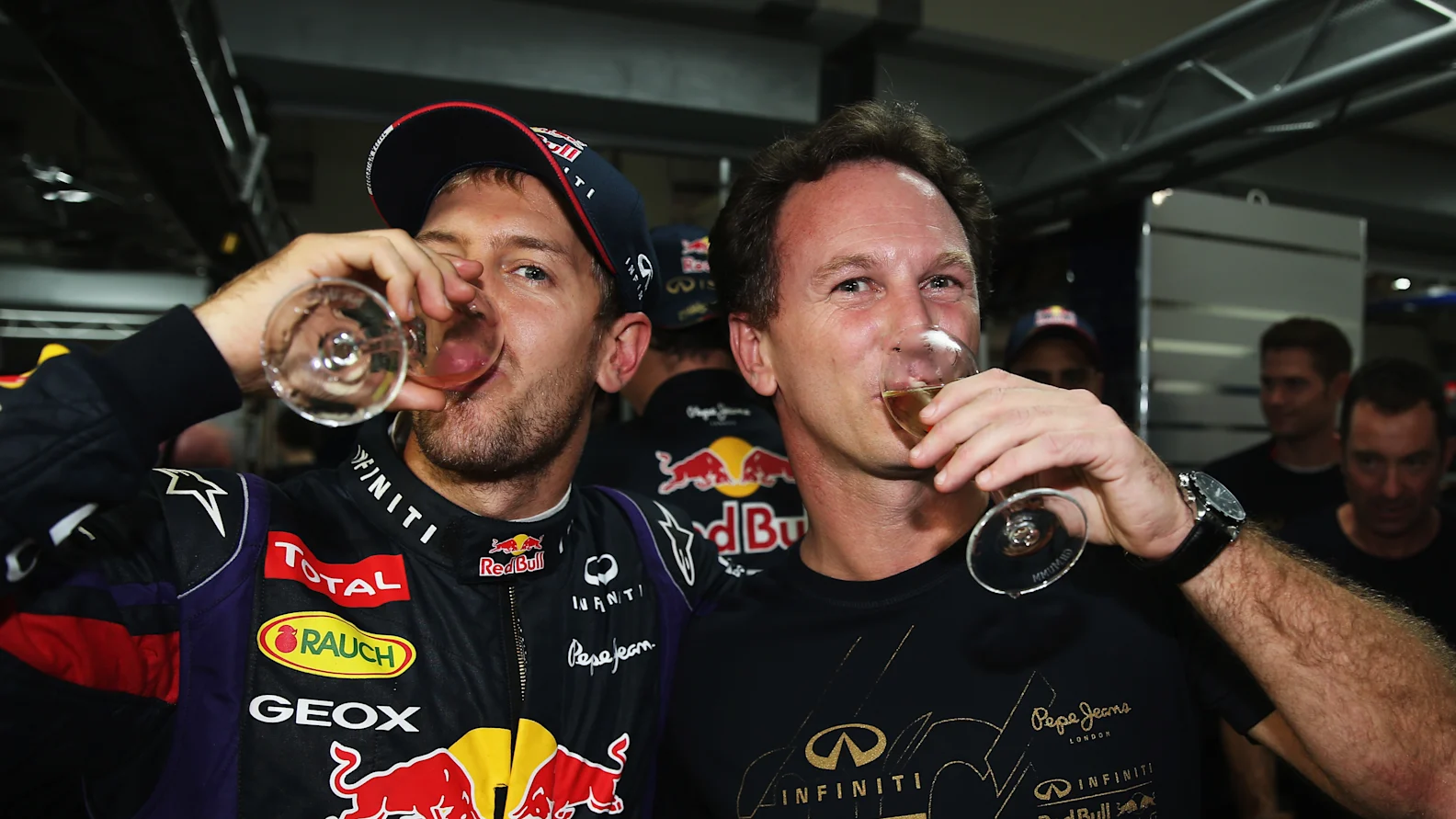 NOIDA, INDIA - OCTOBER 27:  Race winner and 2013 Formula One World Champion Sebastian Vettel of Germany and Infiniti Red Bull Racing celebrates with his Team Principal Christian Horner following the Indian Formula One Grand Prix at Buddh International Circuit on October 27, 2013 in Noida, India.  (Photo by Mark Thompson/Getty Images)