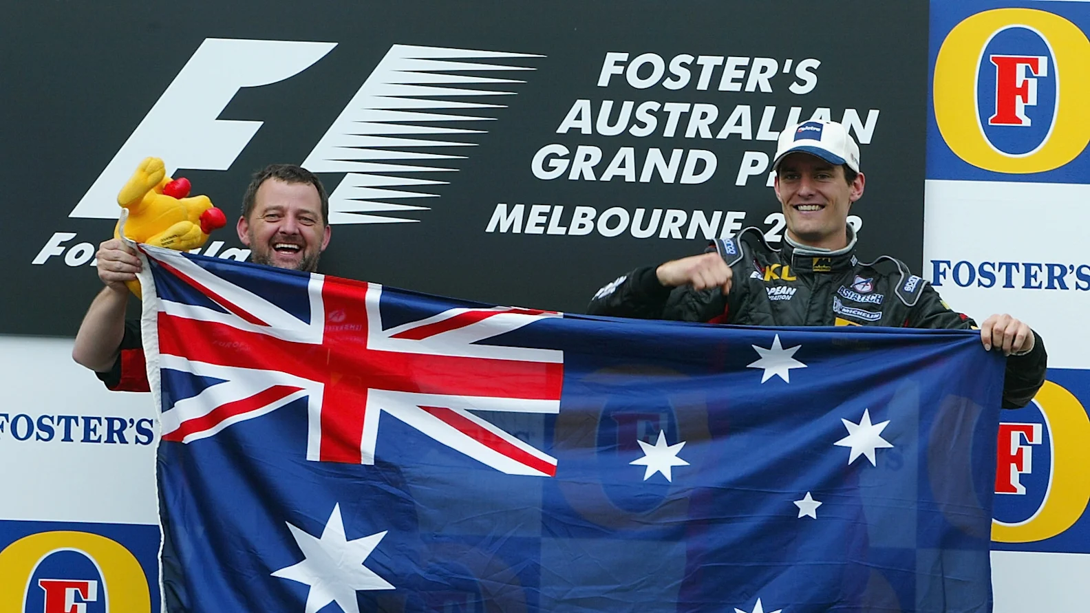 3 Mar 2002:  Mark Webber of Australia and Minardi celebrates with team boss Paul Stoddart after his