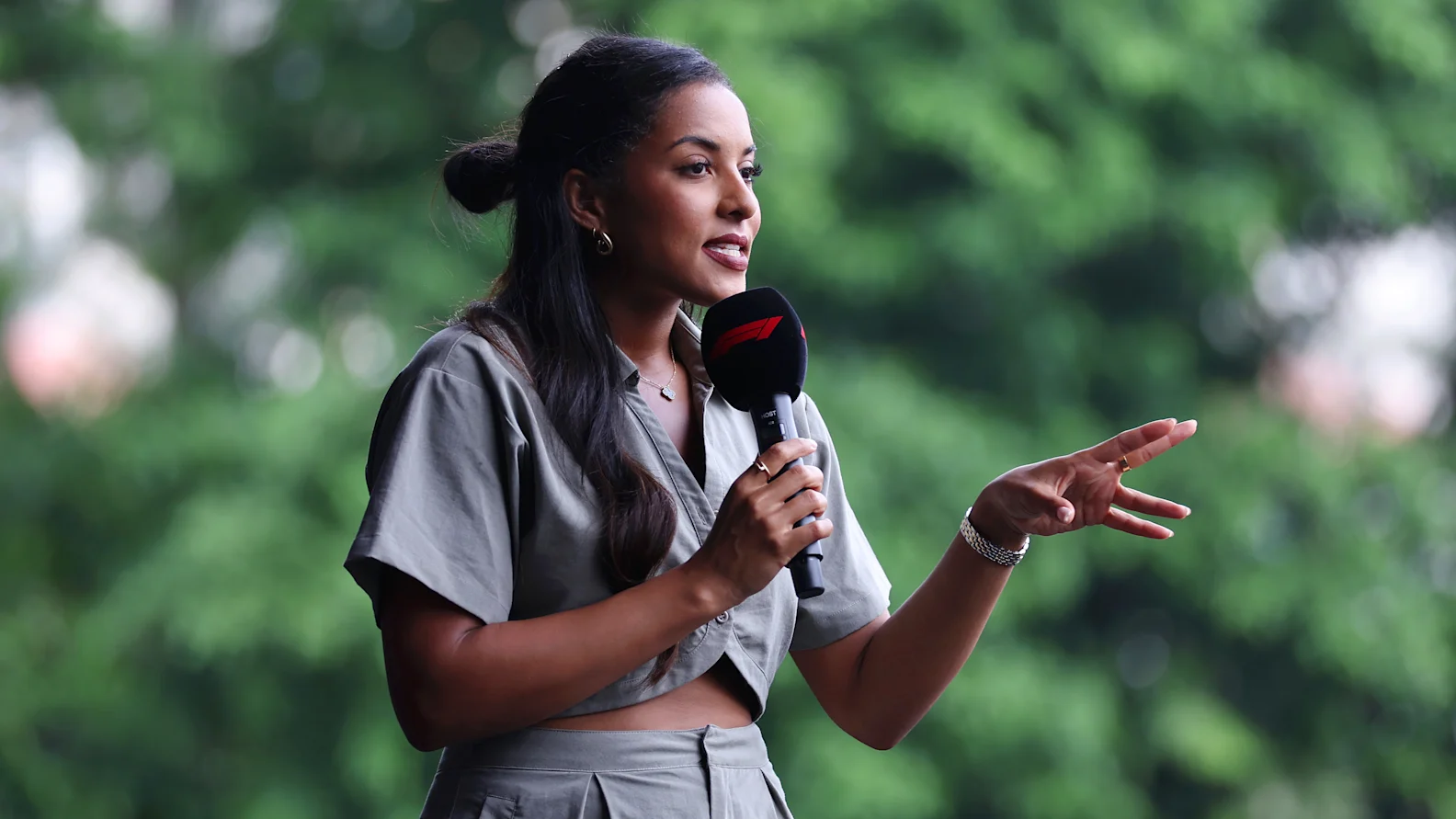 SINGAPORE, SINGAPORE - SEPTEMBER 21: Ariana Bravo talks to the crowd on the fan stage prior to final practice ahead of the F1 Grand Prix of Singapore at Marina Bay Street Circuit on September 21, 2024 in Singapore, Singapore. (Photo by Lars Baron - Formula 1/Formula 1 via Getty Images)