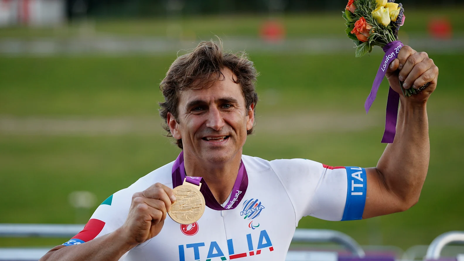 LONGFIELD, ENGLAND - SEPTEMBER 07:  Alessandro Zanardi of Italy poses with his Gold medal after winning the Men's Individual H 4 Road Race on day 9 of the London 2012 Paralympic Games at Brands Hatch on September 7, 2012 in Longfield, England.  (Photo by Harry Engels/Getty Images)
