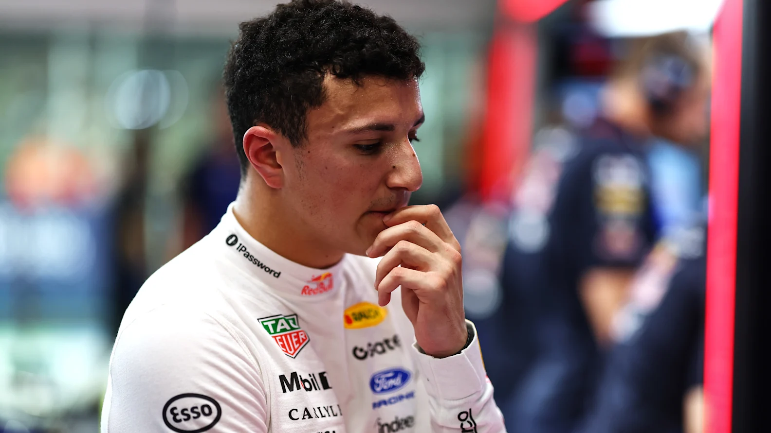 SINGAPORE, SINGAPORE - OCTOBER 10: Isack Hadjar of France and Oracle Red Bull Racing looks dejected in the garage during qualifying ahead of the F1 Grand Prix of Singapore at Marina Bay Street Circuit on October 10, 2026 in Singapore, Singapore. (Photo by Mark Thompson/Getty Images)