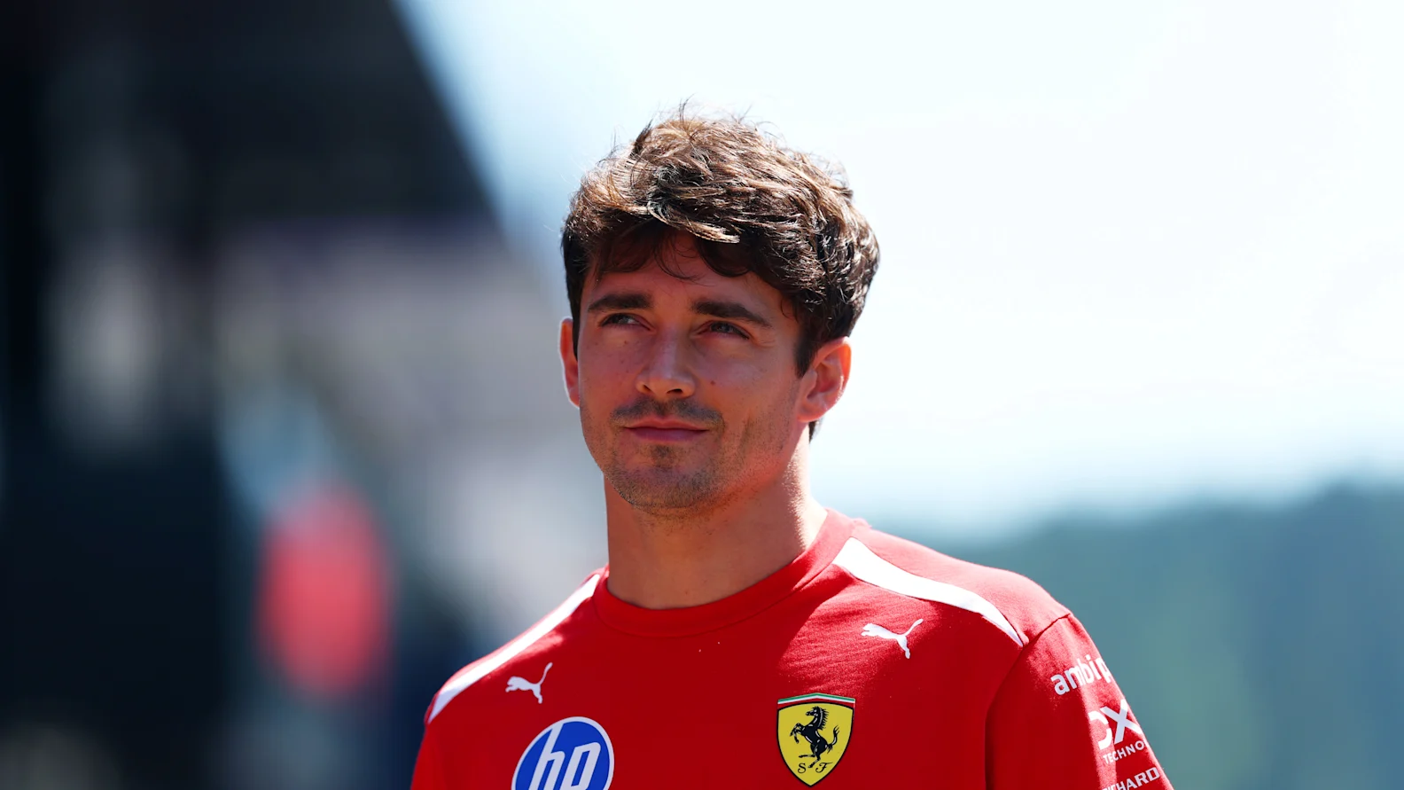 SPIELBERG, AUSTRIA - JUNE 25: Charles Leclerc of Monaco and Scuderia Ferrari arrives in the Paddock