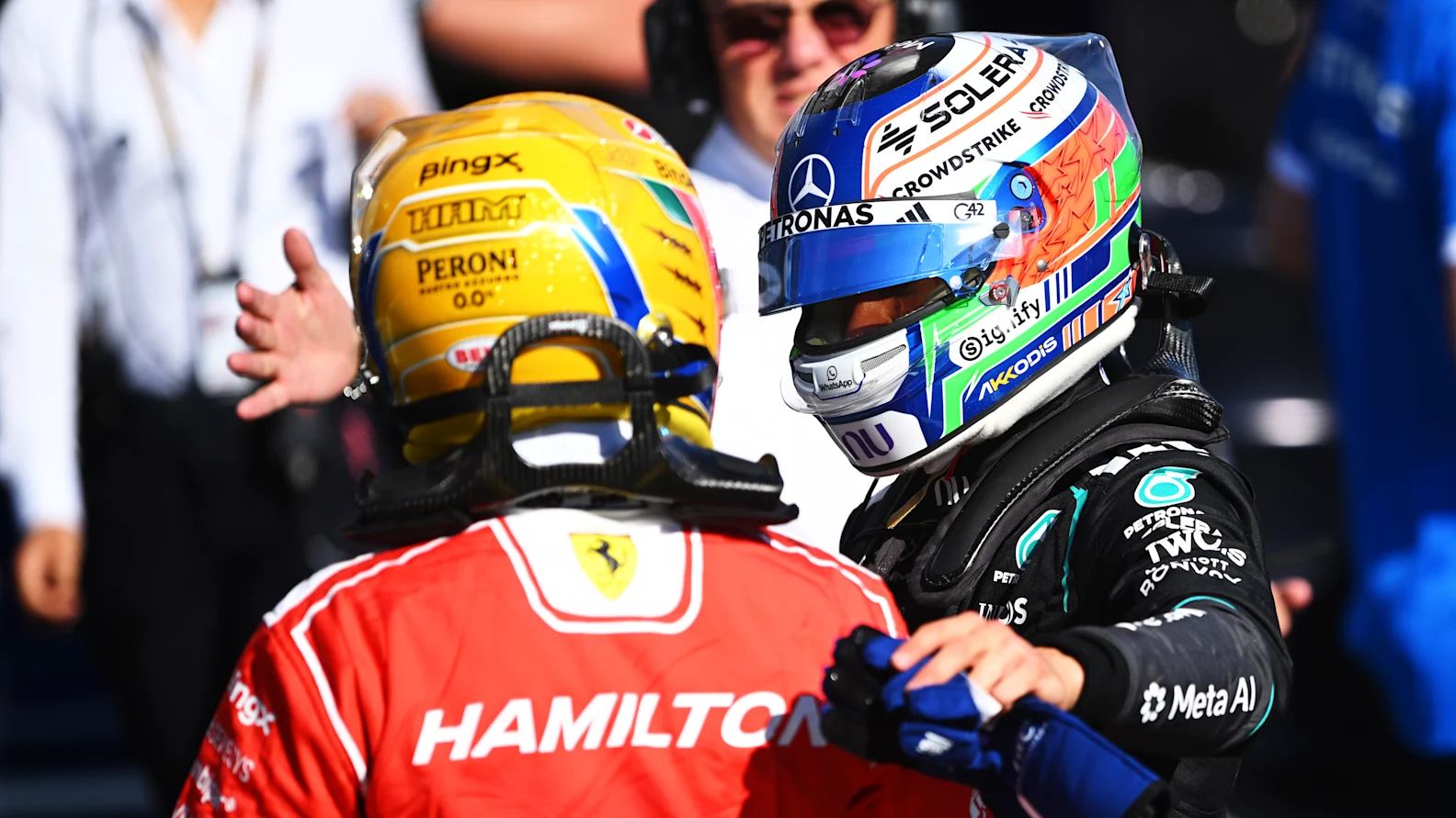 NORTHAMPTON, ENGLAND - JULY 03: Sprint Pole qualifier Lewis Hamilton of Great Britain and Scuderia Ferrari and Sprint 2nd qualifier Andrea Kimi Antonelli of Italy and Mercedes AMG Petronas F1 Team talk in parc ferme during Sprint Qualifying ahead of the F1 Grand Prix of Great Britain at Silverstone Circuit on July 03, 2026 in Northampton, England. (Photo by Rudy Carezzevoli/Getty Images)