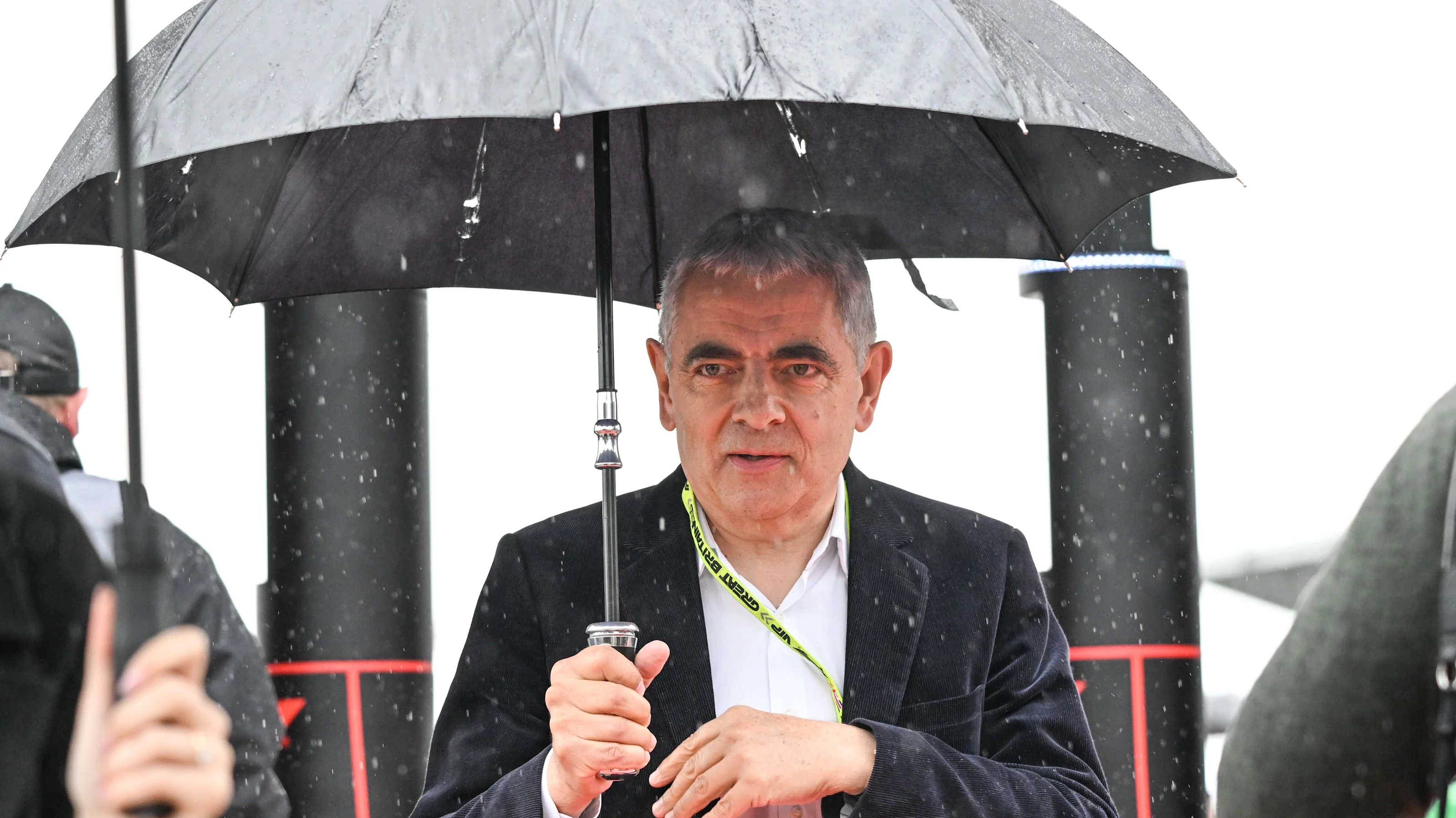 SILVERSTONE, UNITED KINGDOM - JULY 07: Actor Rowan Atkinson follows the Formula 1 British Grand