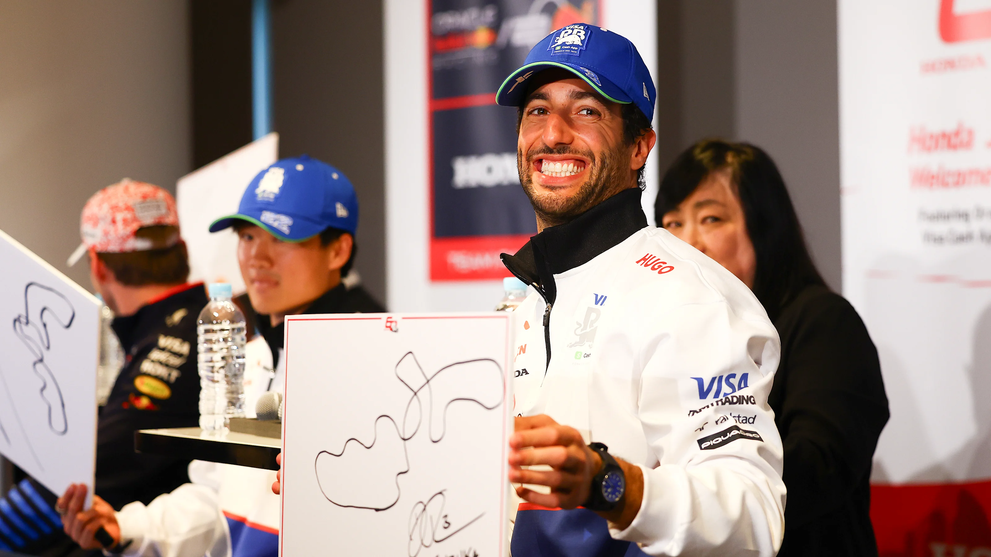 TOKYO, JAPAN - APRIL 03: Daniel Ricciardo of Australia and Visa Cash App RB looks on from the stage