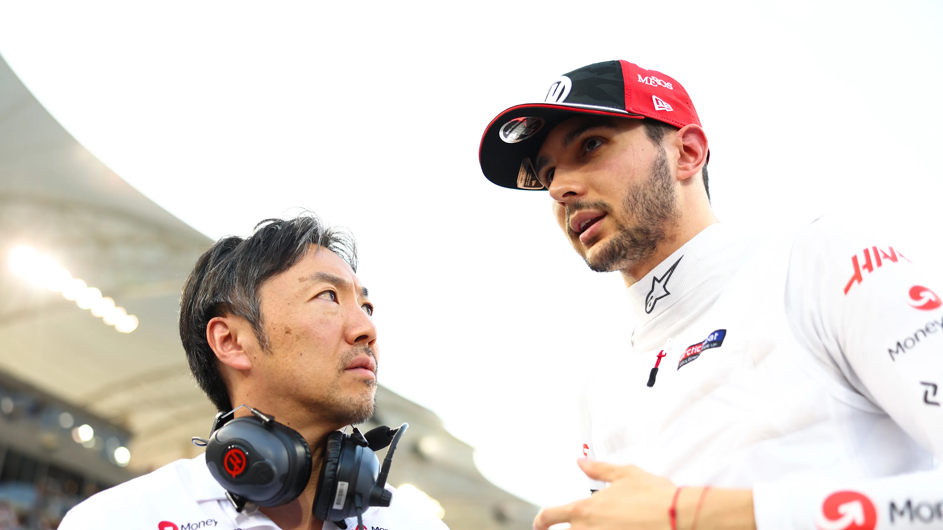 BAHRAIN, BAHRAIN - APRIL 13: Ayao Komatsu, Team Principal of Haas F1 and Esteban Ocon of France and